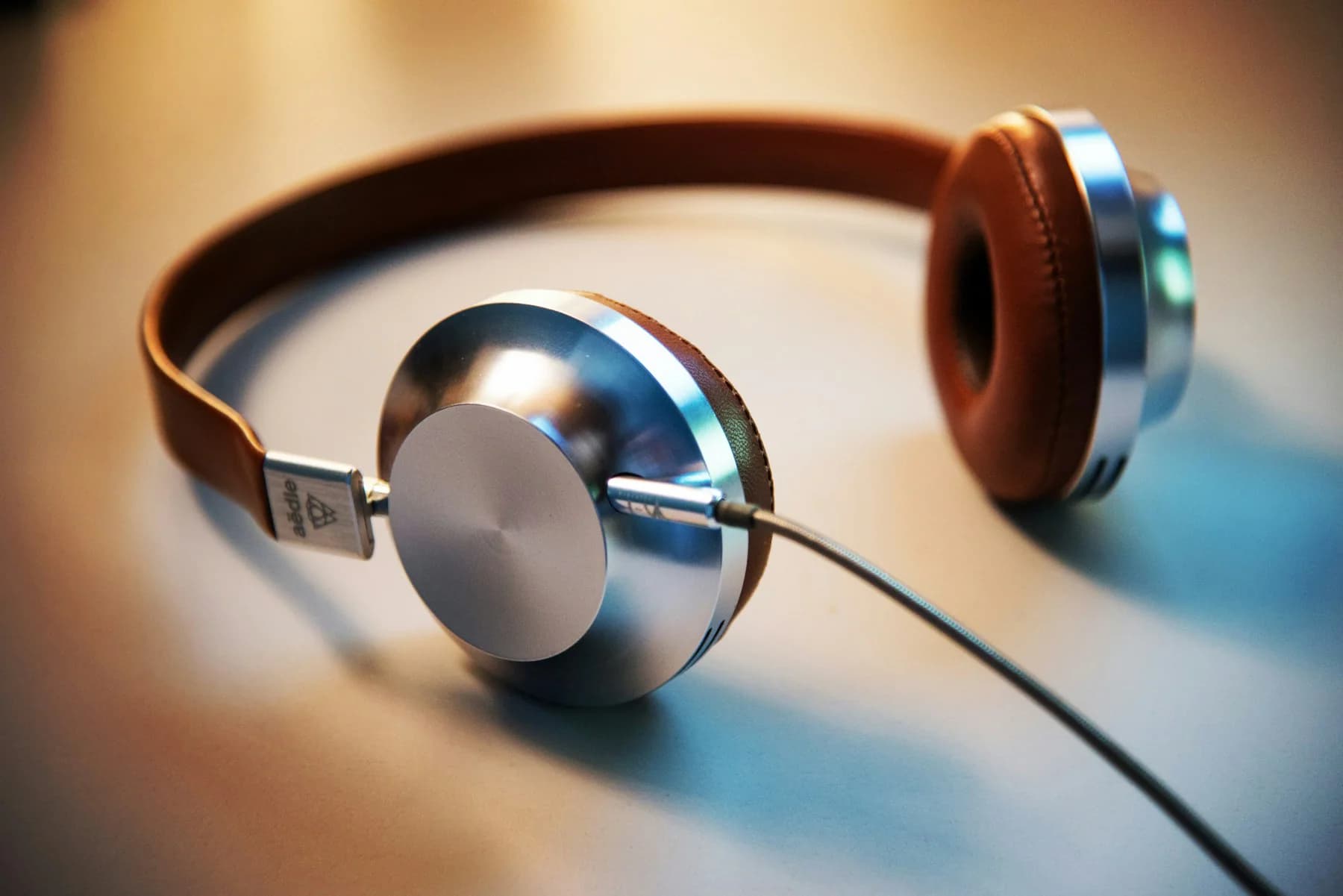 Silver and brown over-ear headphones
